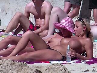 Voyeuristic footage of German lesbians at the beach in bikinis